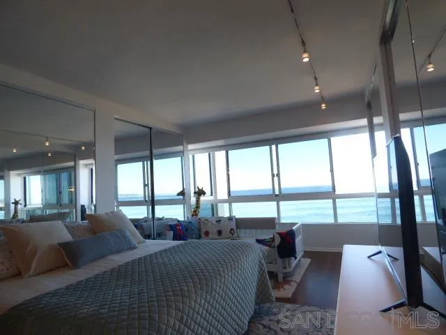 939 Coast Boulevard, Unit 6A La Jolla, CA 92037 - Photo 33 of 38 a living room with furniture and large windows