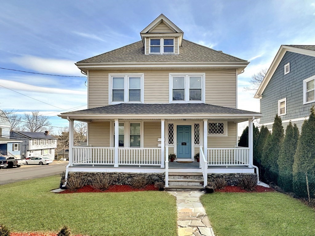a front view of a house with a garden