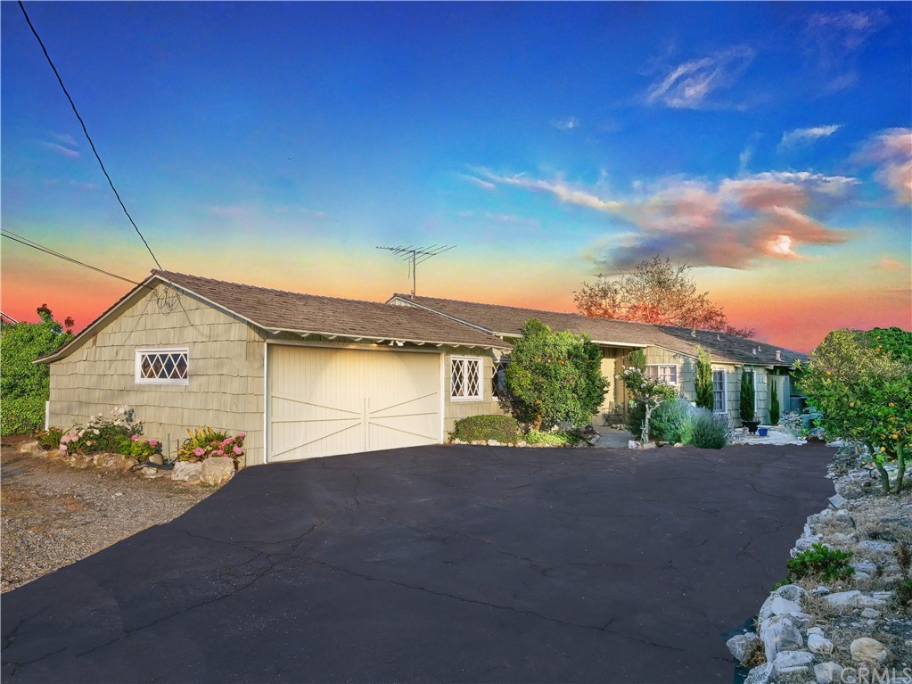 a view of a house with a street