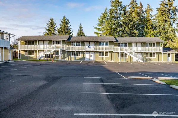 a front view of residential houses with yard