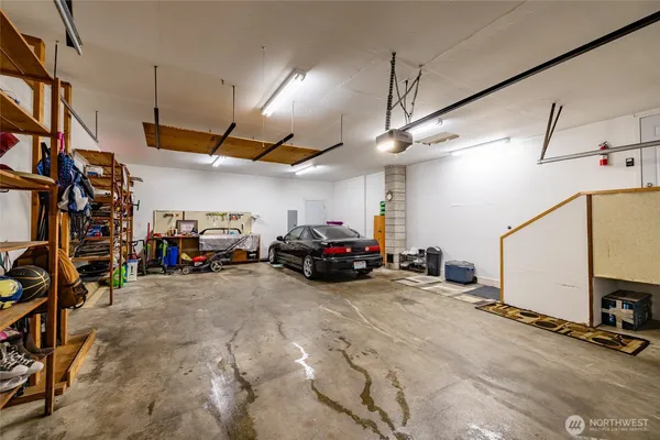 a view of a garage with cars