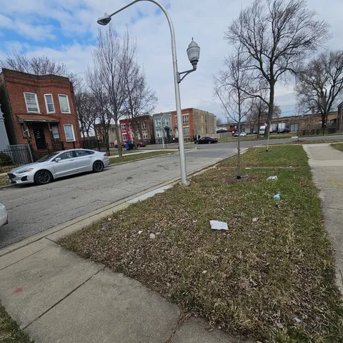 a view of street with parked cars