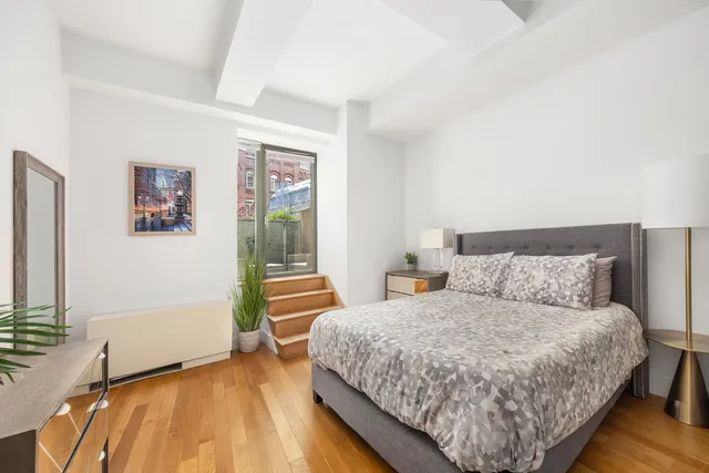 a kitchen with stainless steel appliances granite countertop a sink and a stove