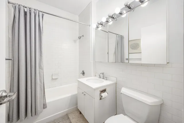 a work room with furniture and wooden floor