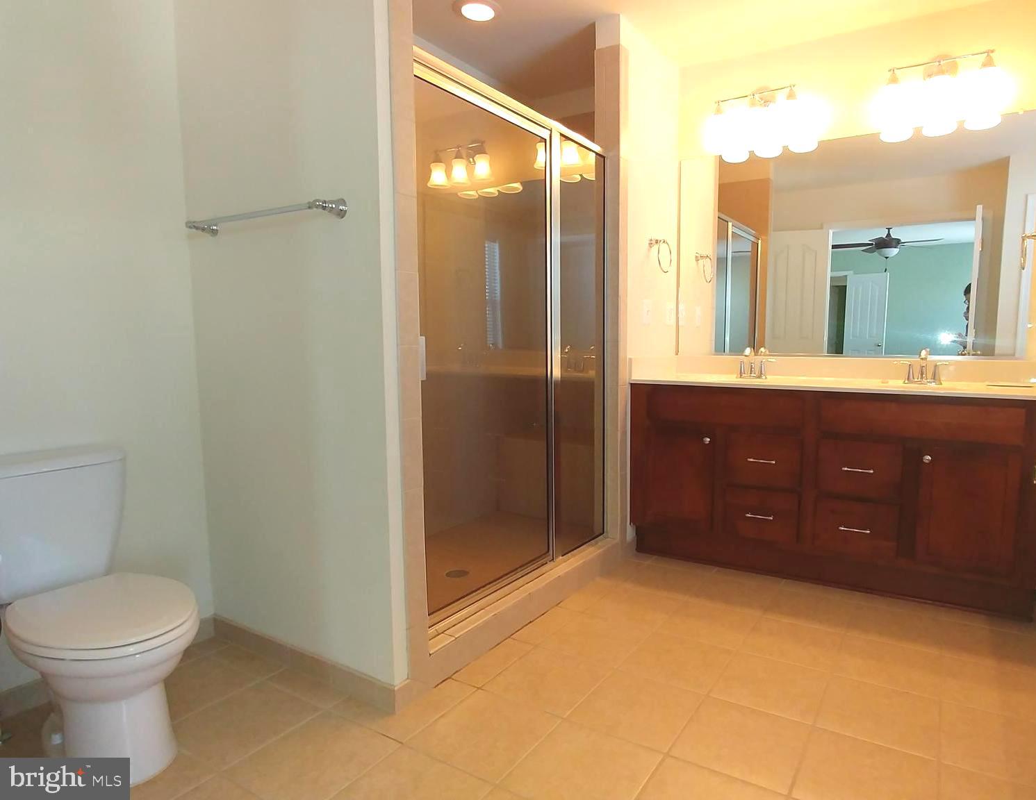 156 Standpipe Road Culpeper, VA 22701 - Photo 23 of 27 a bathroom with a granite countertop sink toilet and shower