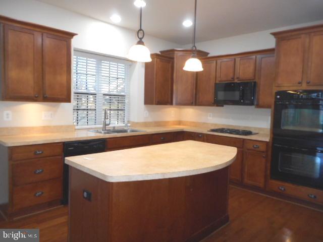 156 Standpipe Road Culpeper, VA 22701 - Photo 7 of 27 a kitchen with stainless steel appliances granite countertop a sink a stove and a microwave