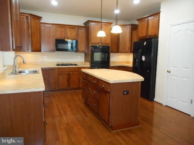156 Standpipe Road Culpeper, VA 22701 - Photo 8 of 27 a kitchen with a sink stove and refrigerator