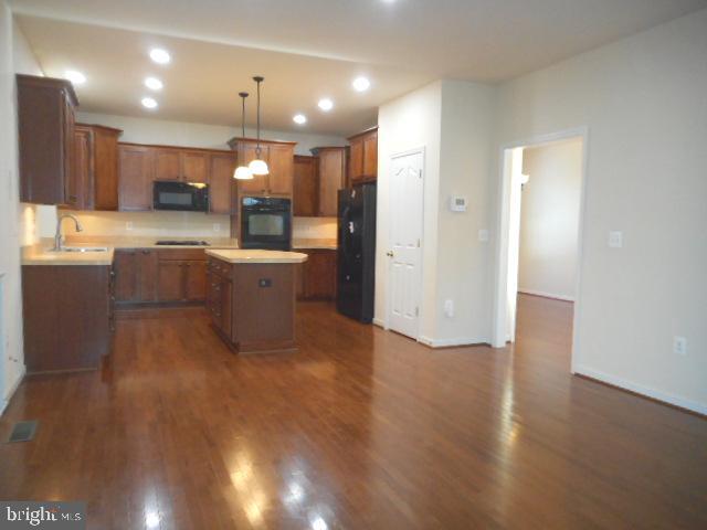 156 Standpipe Road Culpeper, VA 22701 - Photo 9 of 27 a view of kitchen with cabinets and wooden floor