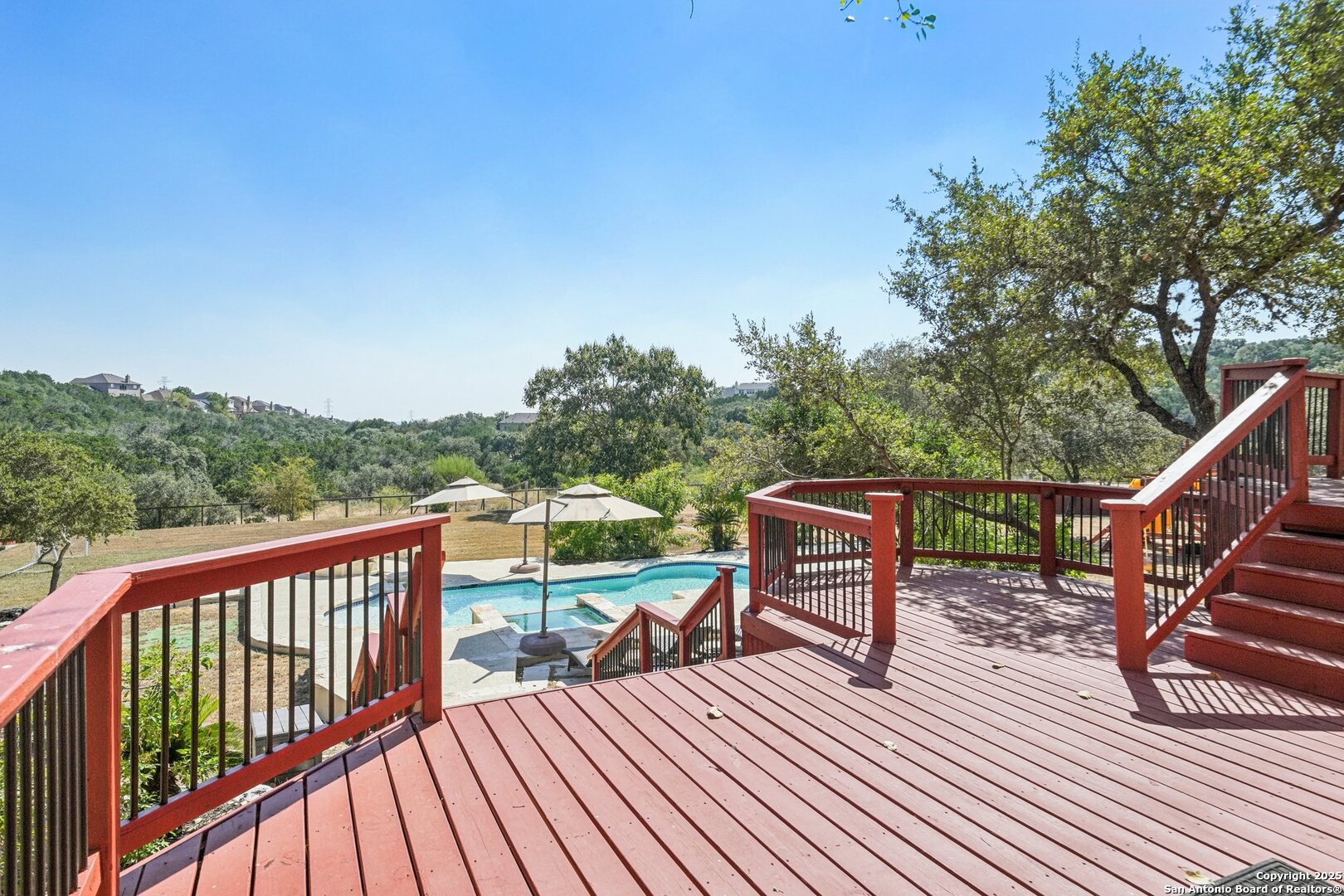 718 Ruidosa Downs Helotes, TX 78023 - Photo 39 of 50 a view of a deck with wooden floor and fence with a large garden
