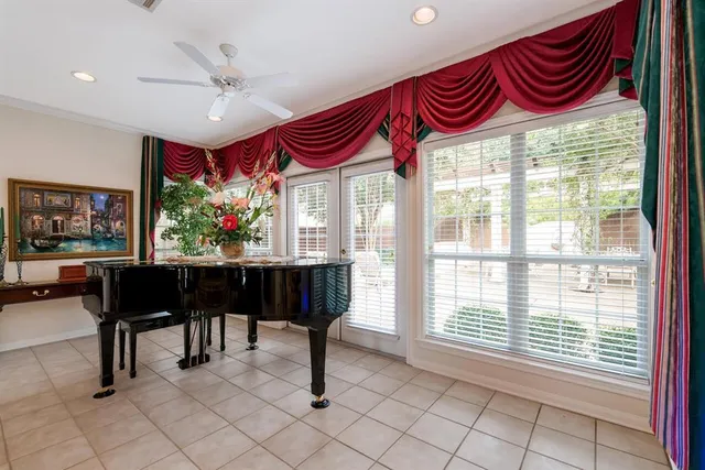 a view of a livingroom with furniture and a floor to ceiling window