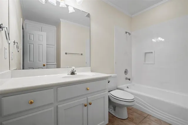 a bathroom with a sink a toilet and bathtub
