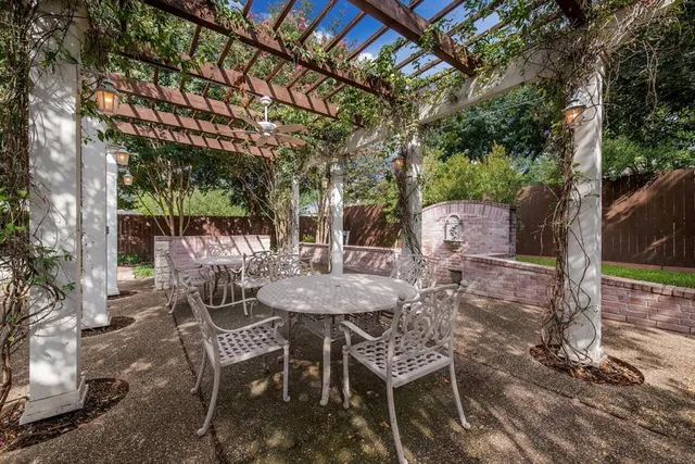 a view of a chairs and table in the patio