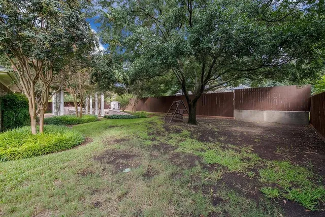 a backyard of a house with lots of green space