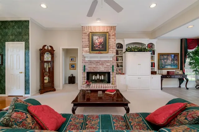 a living room with furniture and a fireplace