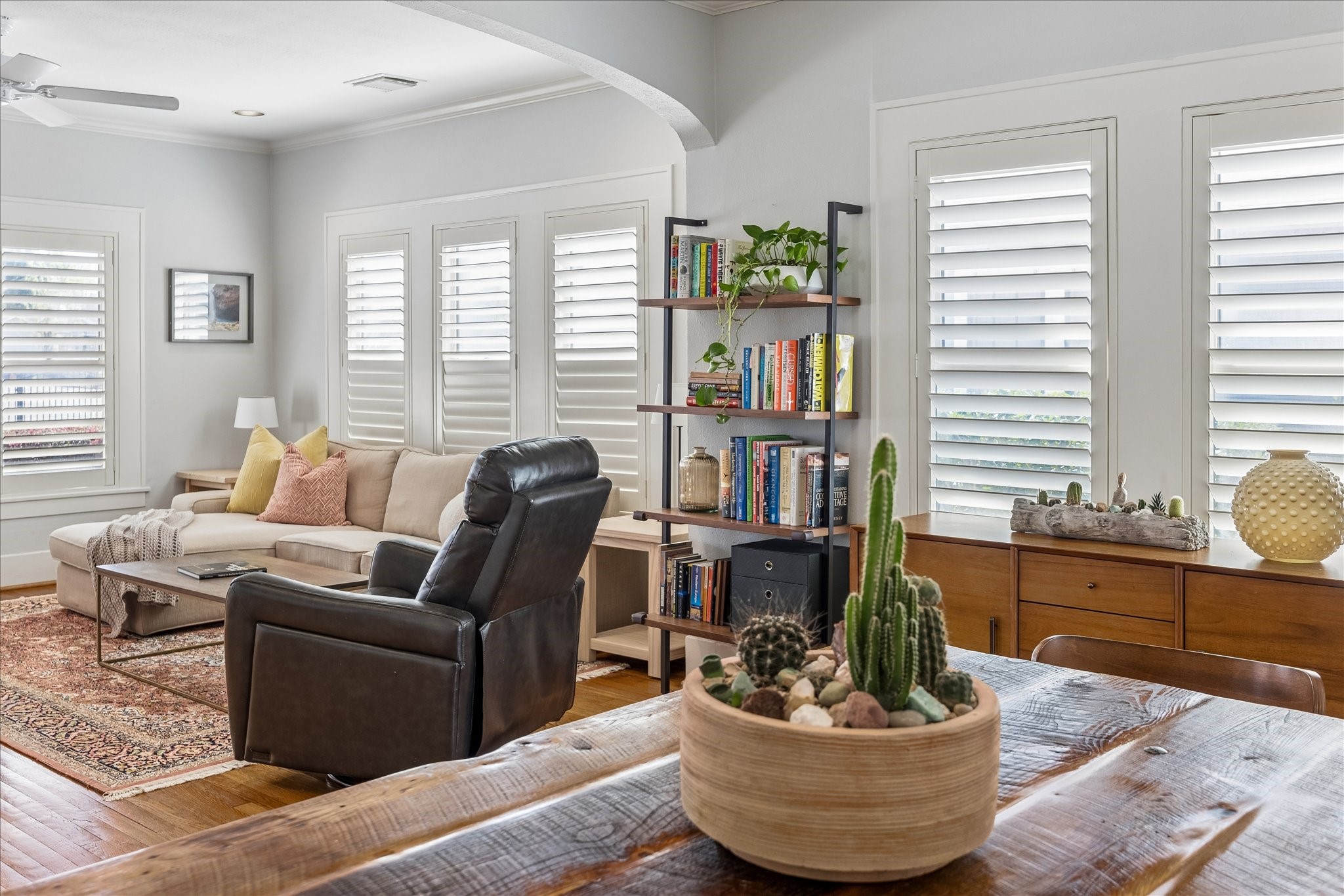 919 Key Street Houston, TX 77009 - Photo 11 of 39 A warm, inviting living space accented by rich wood tones, custom shutters, and architectural archways that add depth and character throughout.
