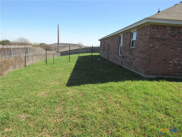 a backyard of a house with a garden