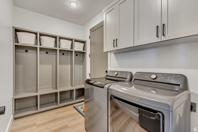 1389 1440 East, Unit 1 Payson, UT 84651 - Photo 13 of 17 Mudroom featuring built-in gray cabinetry with individual cubbies and storage shelves, complemented by light wood-finish flooring