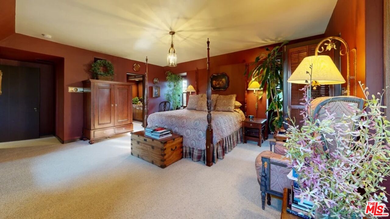 570 South Mapleton Drive Los Angeles, CA 90024 - Photo 18 of 23 a living room filled with furniture and a chandelier