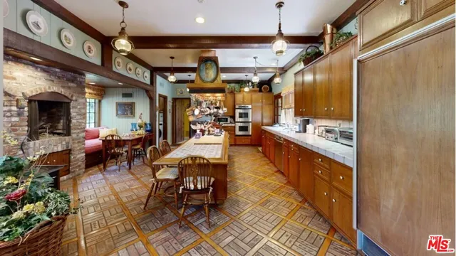a dining room with furniture window and wooden floor
