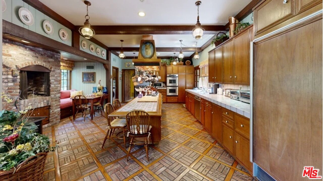 570 South Mapleton Drive Los Angeles, CA 90024 - Photo 19 of 23 a view of a dining room with furniture