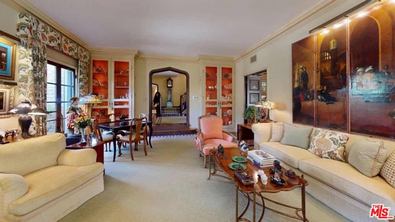 570 South Mapleton Drive Los Angeles, CA 90024 - Photo 20 of 23 a living room with furniture and a large window