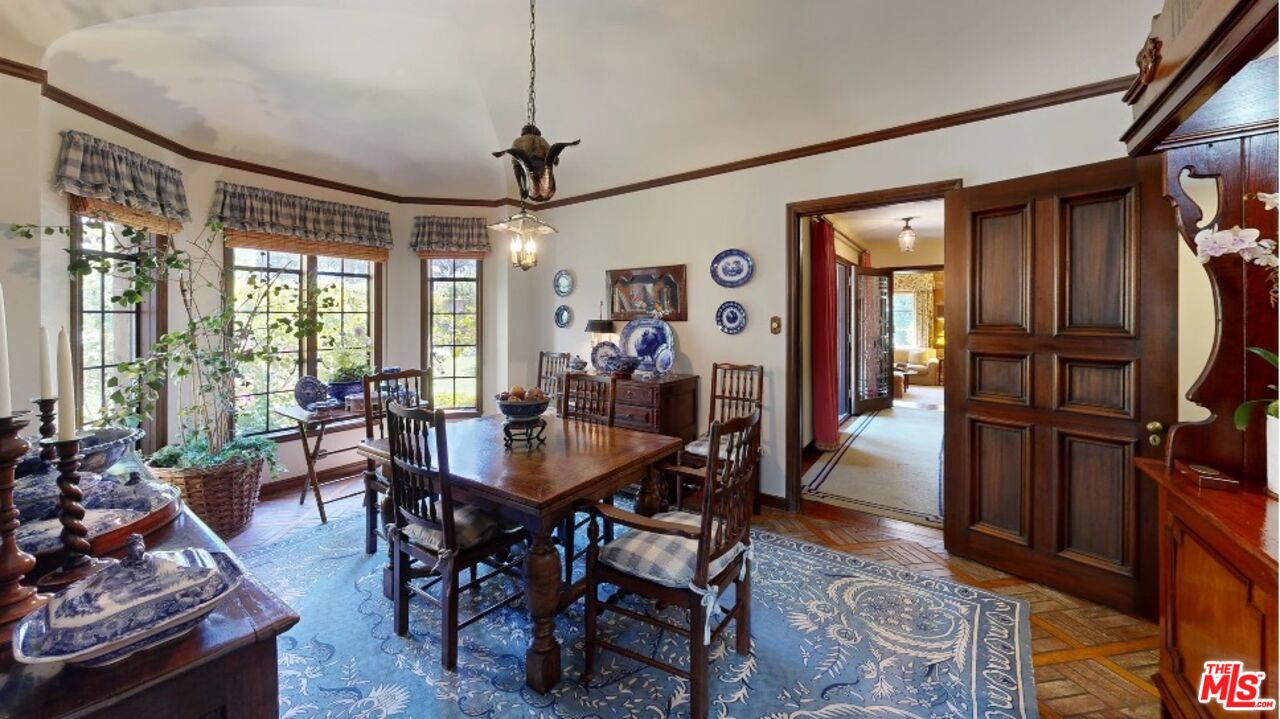 570 South Mapleton Drive Los Angeles, CA 90024 - Photo 22 of 23 a view of a dining room with furniture window and wooden floor