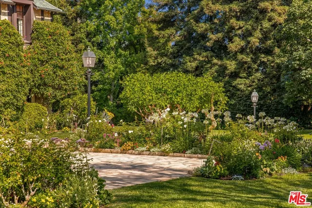 a view of a pathway both side of grassy field