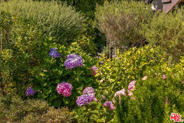 a view of a swimming pool with an outdoor space and seating area