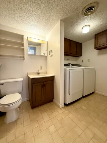 a living room with a couch and a flat screen tv