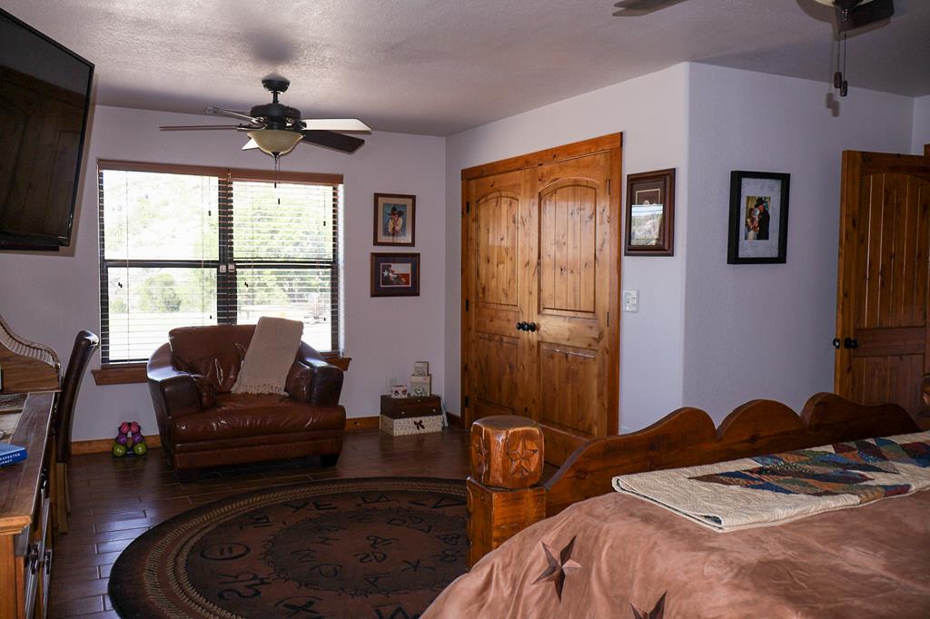 2970 Rr 2523 Del Rio, TX 78840 - Photo 18 of 28 a bedroom with a bed and wooden floor