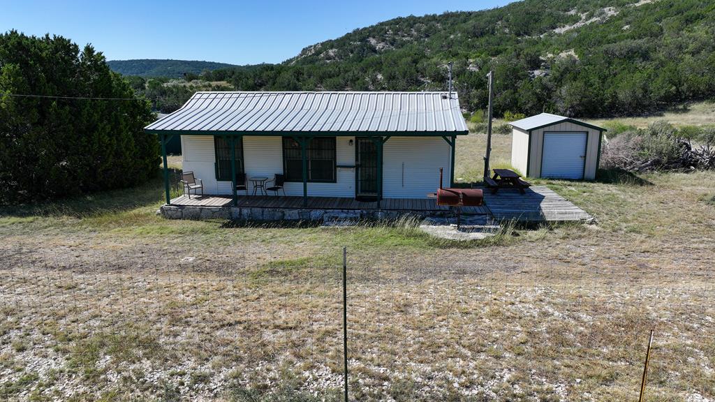 2970 Rr 2523 Del Rio, TX 78840 - Photo 23 of 28 a front view of a house with garden