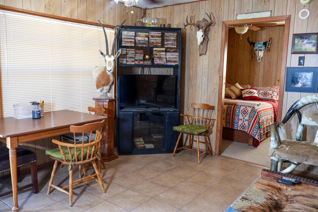 2970 Rr 2523 Del Rio, TX 78840 - Photo 26 of 28 a dining room with furniture and a flat screen tv