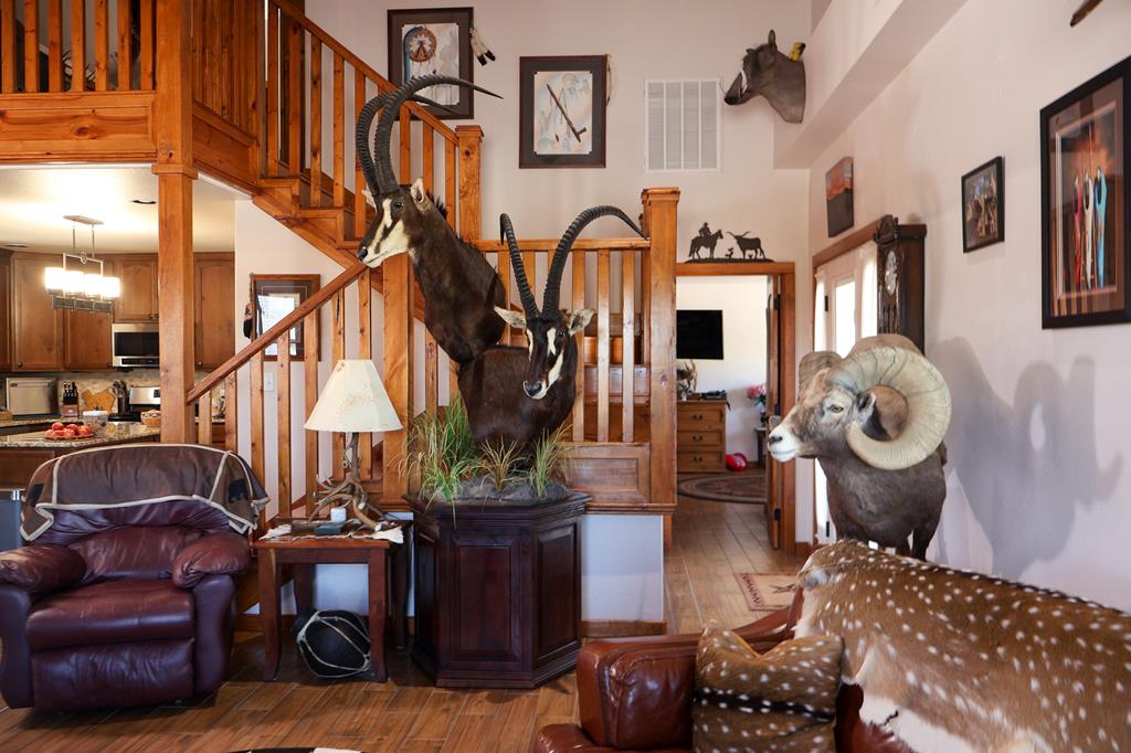 2970 Rr 2523 Del Rio, TX 78840 - Photo 8 of 28 a living room with furniture a fireplace and lots of windows