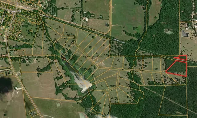 a view of a balcony with floor to ceiling windows and wooden floor