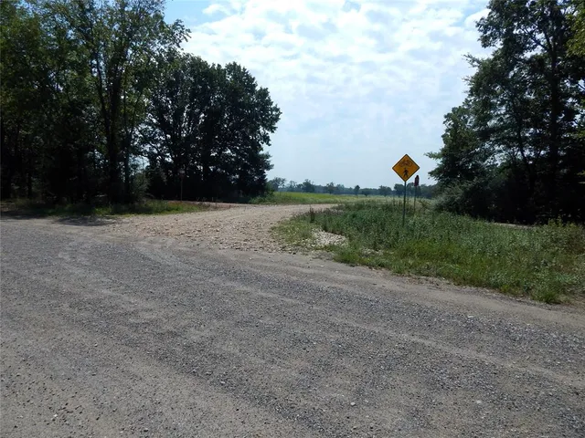 a view of a backyard of the house
