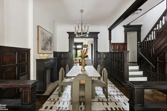 a front view of a house with wooden floor fireplace and windows