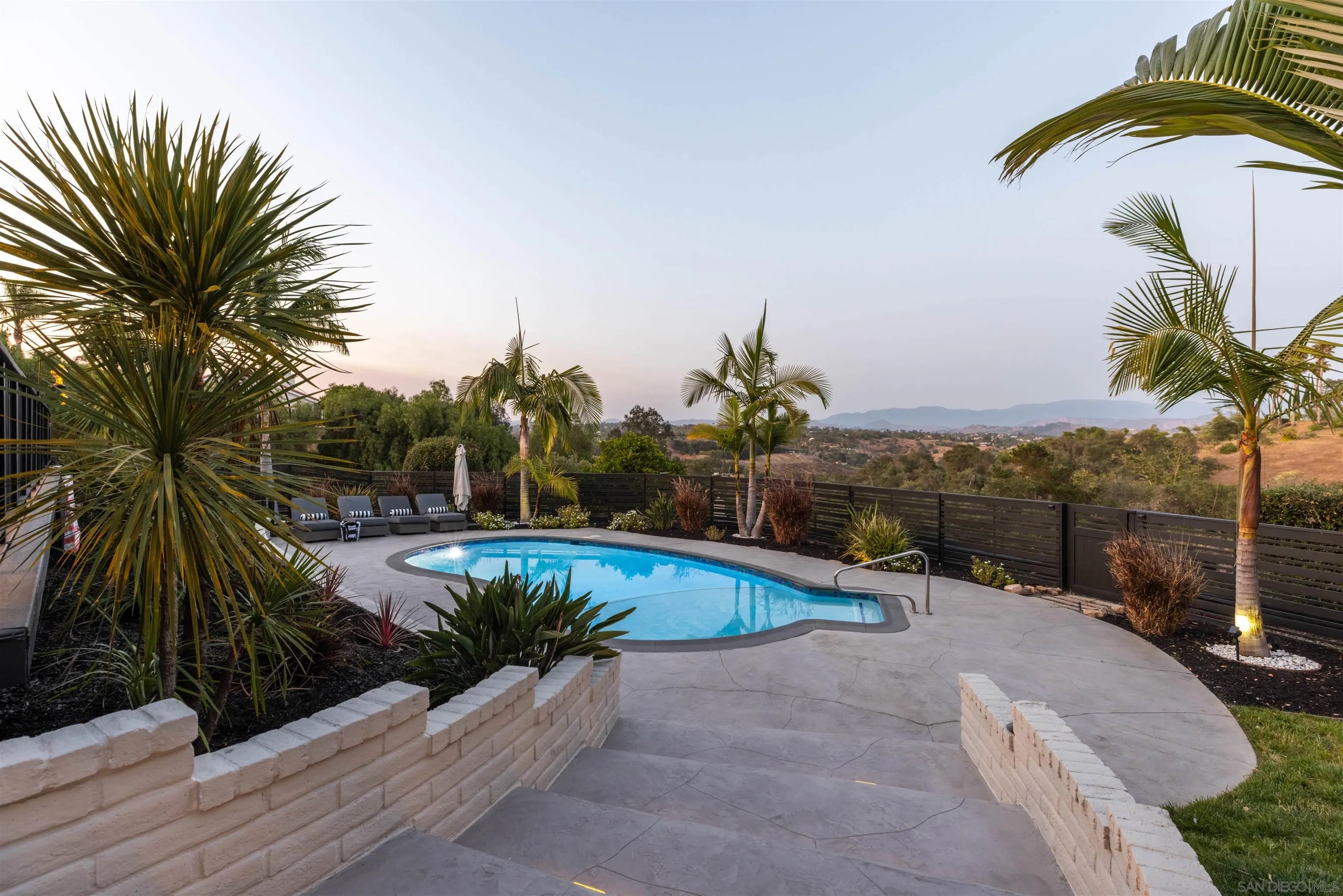 521 Rancho Camino Fallbrook, CA 92028 - Photo 64 of 72 a view of a swimming pool with a patio