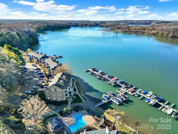 an aerial view of a house with a lake view