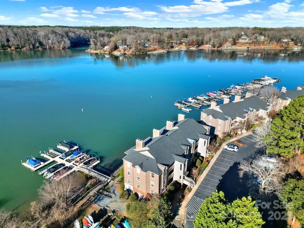 an aerial view of a house with a lake view