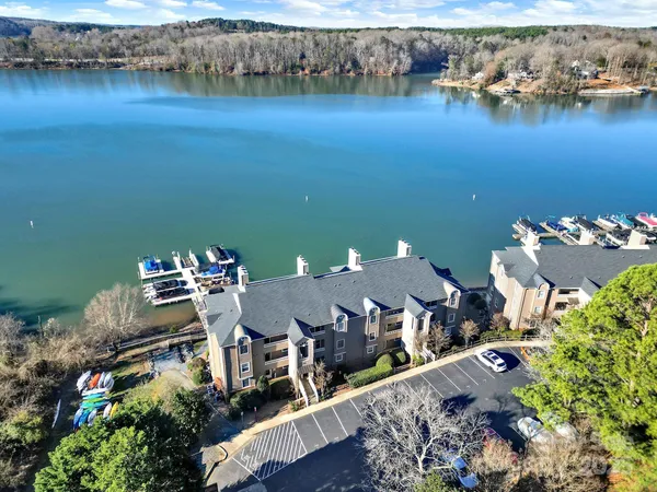 an aerial view of a house with a lake view