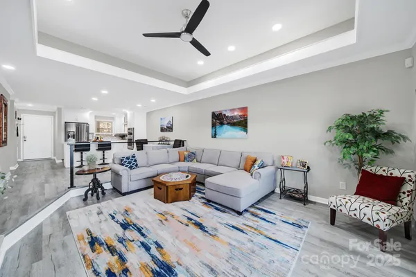 a living room with furniture and a rug