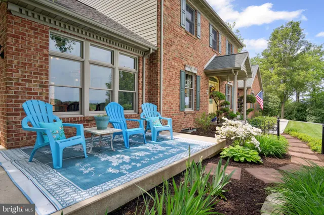 a view of a garden with a building in the background