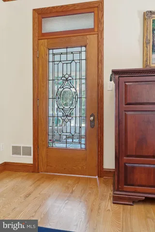 a bathroom with a granite countertop sink double and mirror
