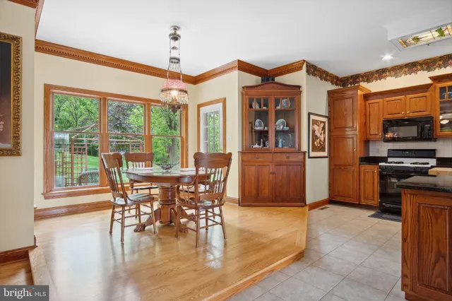a bedroom with a bed lamp and a window