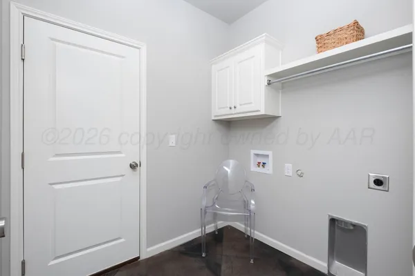 a room with a refrigerator and a sink