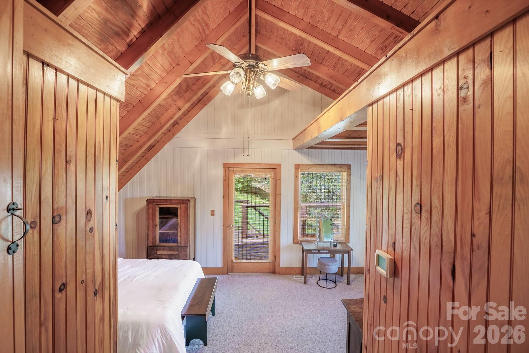 440 Huskey Road Bryson City, NC 28713 - Photo 18 of 42 a bedroom with furniture and large windows