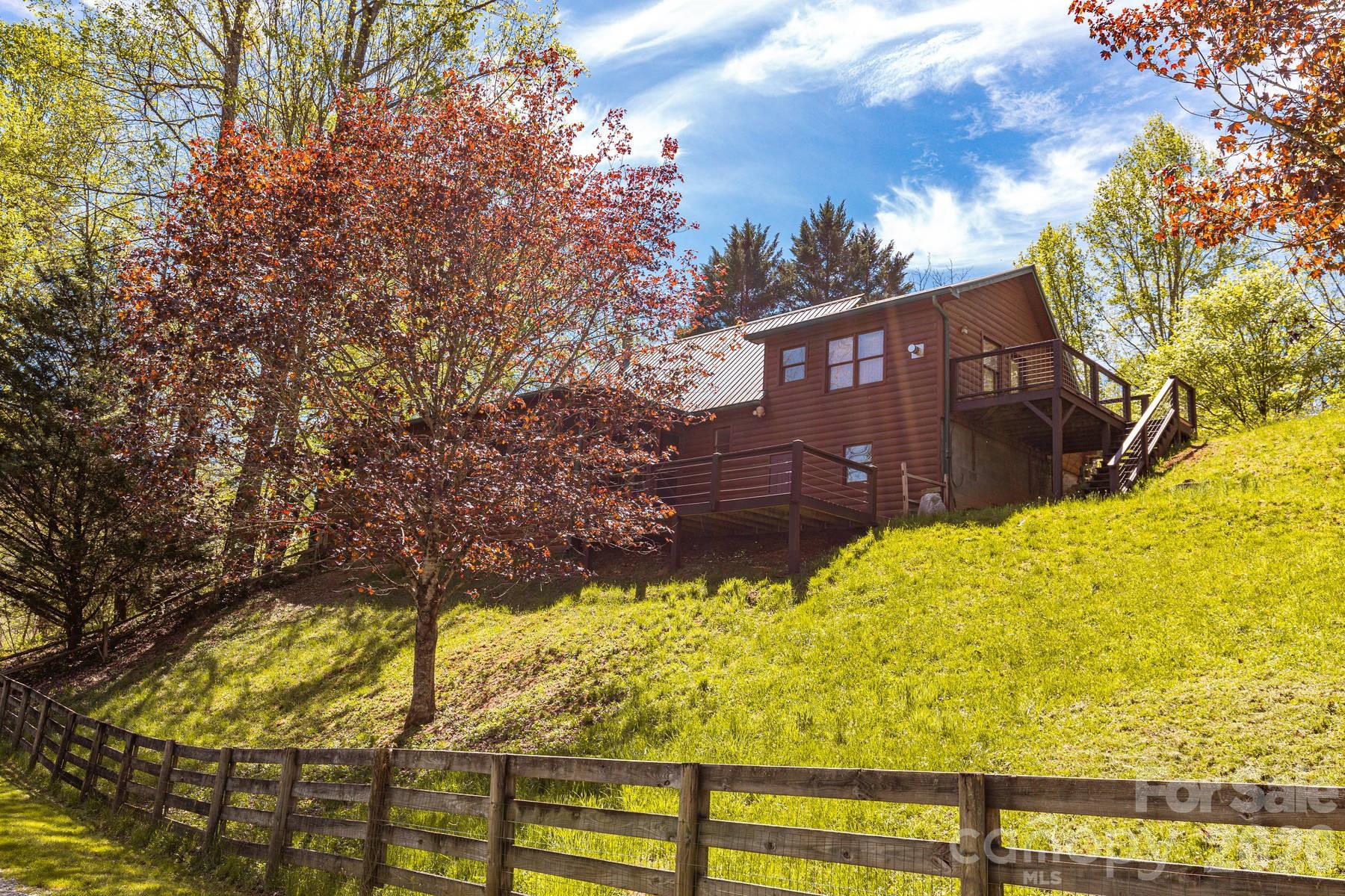440 Huskey Road Bryson City, NC 28713 - Photo 2 of 42 a view of a house with a yard