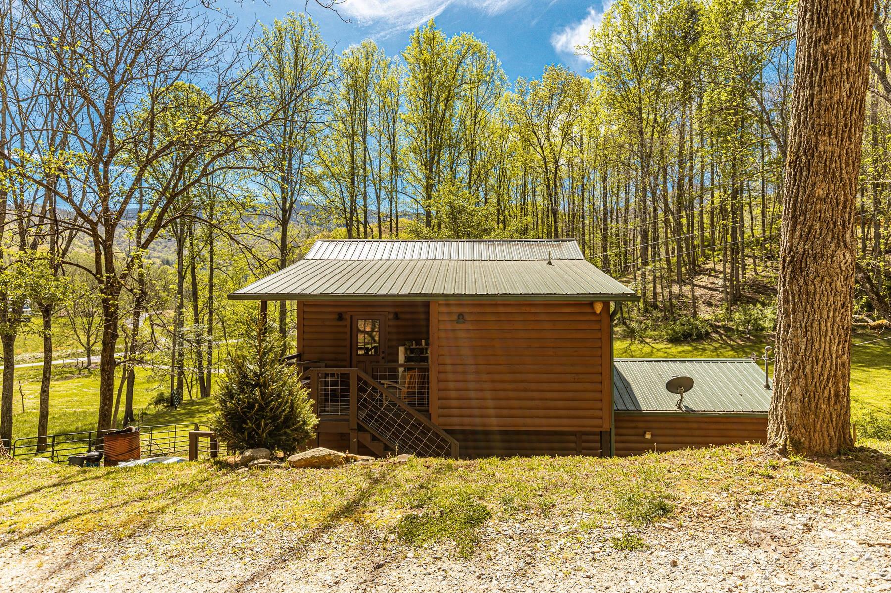 440 Huskey Road Bryson City, NC 28713 - Photo 26 of 42 a front view of a house with a yard covered with snow