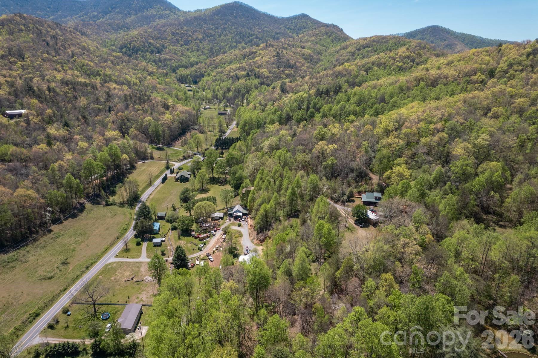 440 Huskey Road Bryson City, NC 28713 - Photo 42 of 42 an aerial view of residential house with parking space and mountain view