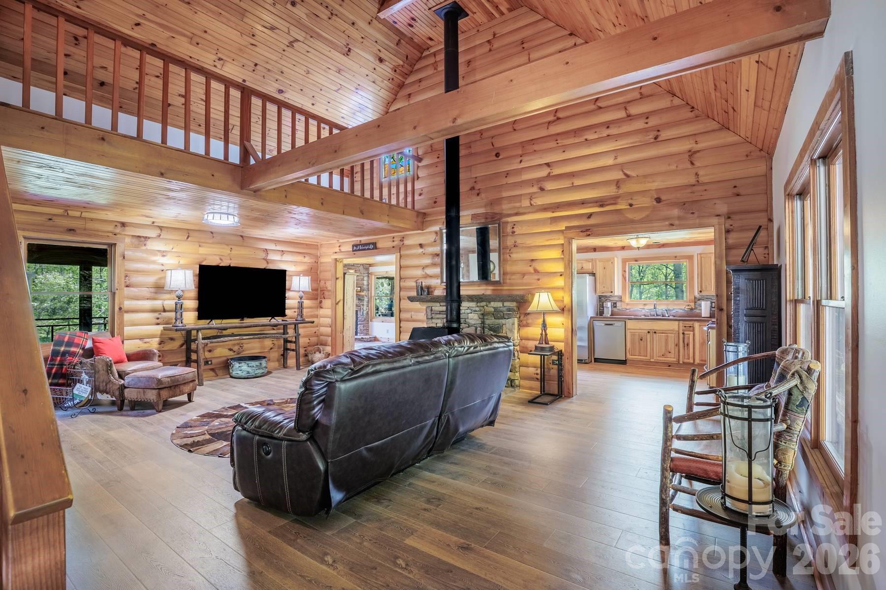 440 Huskey Road Bryson City, NC 28713 - Photo 5 of 42 a living room with furniture wooden floor and a flat screen tv